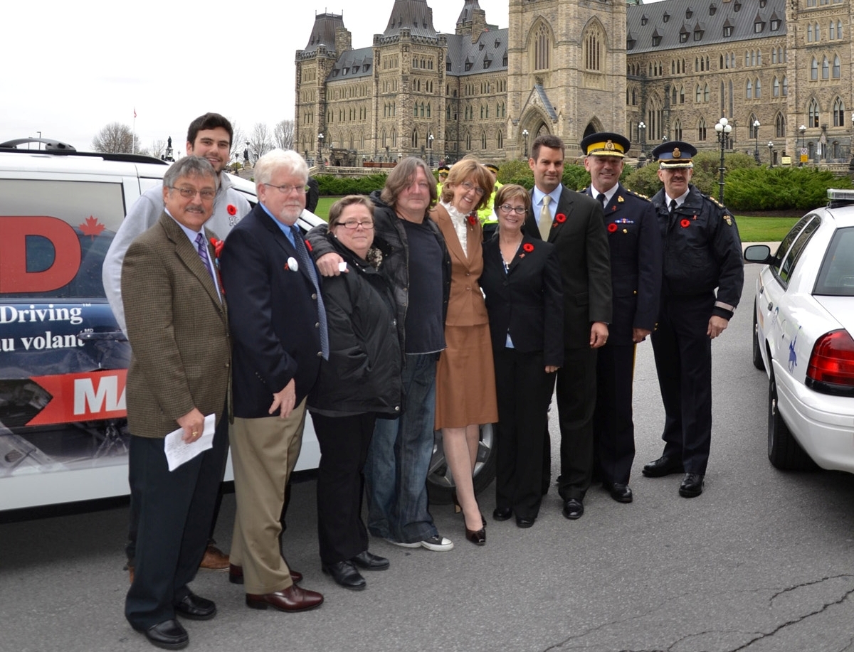 Left to right: Gaetan Gendron, MADD Ottawa; Lucas Hauer; Gregg Thomson, MADD Ottawa; Marie Claude Morin, MADD Quebec Region; Michael Hanson, original drummer and founding member of Glass Tiger; Minister Marjory LeBreton, Leader of the Government in the Senate; MADD Canada National President Denise Dubyk; John O'Donnell, President and CEO of Allstate Insurance Company of Canada; RCMP Commissioner Bob Paulson; OPP Chief Superintendent Gary Couture.