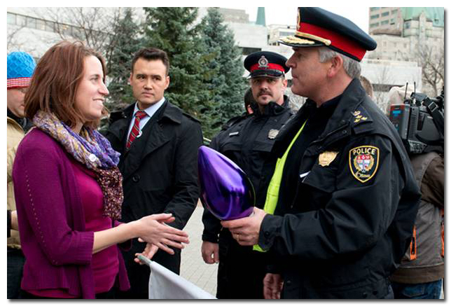 Erin Leigh, executive director of the Ottawa Coalition to End Violence Against Women (OCTEVAW), meeting with representatives of the Ottawa Police Service.